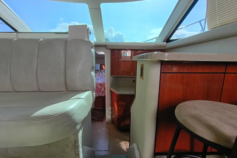 Slide: The Image of Interior of 1997 Sea Ray 370 Aft Cabin yacht with seating and wood cabinetry. - 72