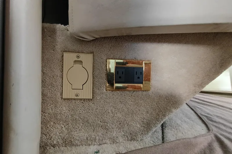 Slide: The Image of Power outlets on carpeted wall of 1997 Sea Ray 370 Aft Cabin boat. - 87