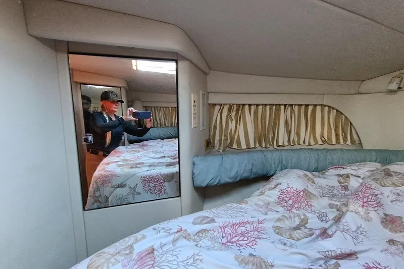 Slide: The Image of Interior of 1997 Sea Ray 370 Aft Cabin with bed and mirror reflection. - 88