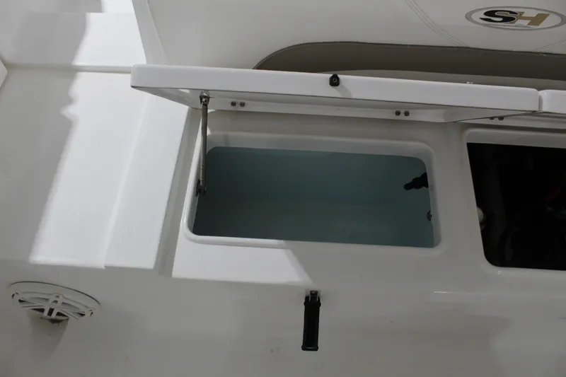 Slide: The Image of Open storage compartment on 2012 Sea Hunt Edge 24 boat. - 11