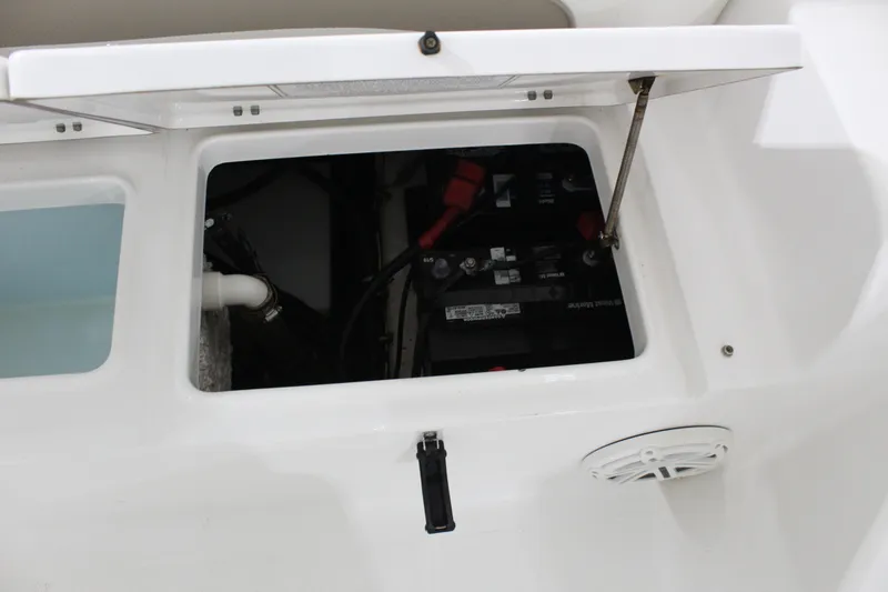 Slide: The Image of Open battery compartment of 2012 Sea Hunt Edge 24 boat, showing internal components. - 12