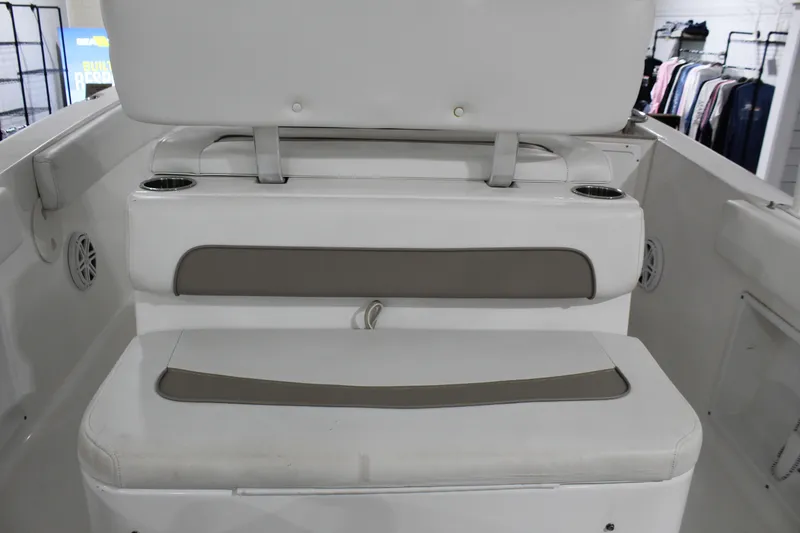 Slide: The Image of 2012 Sea Hunt Edge 24 boat interior seating with cup holders and storage. - 13