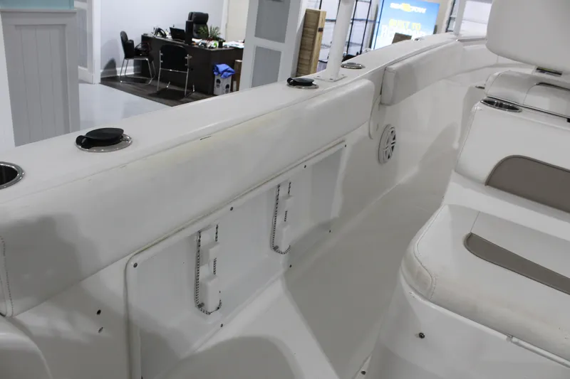 Slide: The Image of 2012 Sea Hunt Edge 24 boat interior with seating and storage compartments. - 18