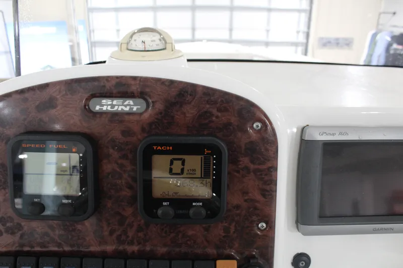 Slide: The Image of Dashboard of a 2012 Sea Hunt Edge 24 boat with gauges and GPS system. - 21