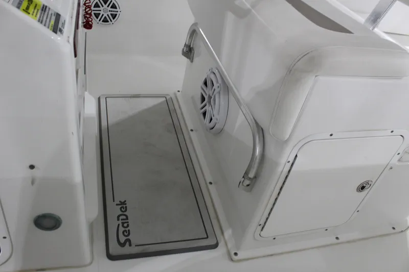 Slide: The Image of Interior of a 2012 Sea Hunt Edge 24 boat with SeaDek flooring and speaker. - 22