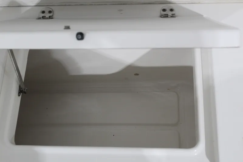 Slide: The Image of Open storage compartment on a 2012 Sea Hunt Edge 24 boat. - 30