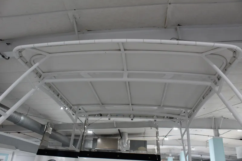 Slide: The Image of 2012 Sea Hunt Edge 24 boat T-top structure in indoor setting. - 31