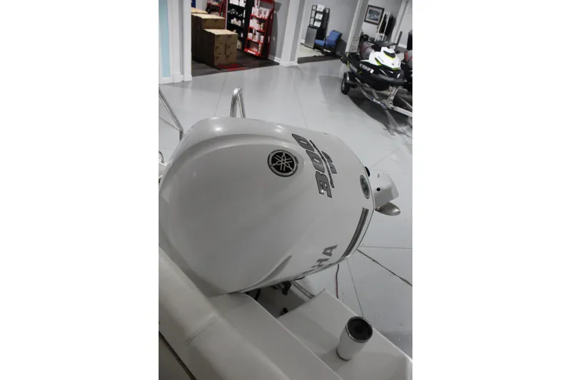 Slide: The Image of 2012 Sea Hunt Edge 24 with Yamaha 300 outboard motor in showroom. - 33