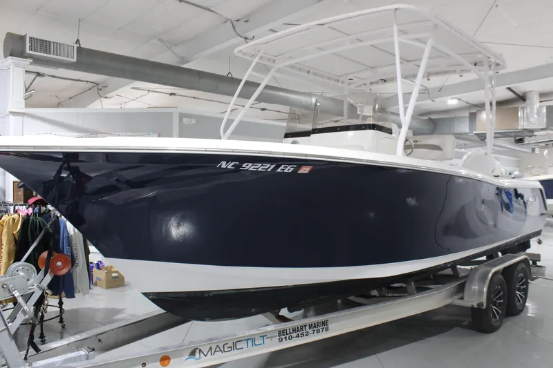 Slide: The Image of 2012 Sea Hunt Edge 24 boat on trailer in indoor showroom. - 4