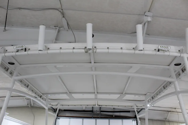 Slide: The Image of T-top of 2012 Sea Hunt Edge 24 boat with rod holders and lights. - 7