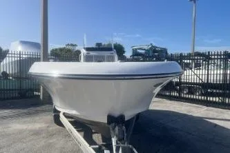 Slide: The Image of 2022 Wellcraft 202 Fisherman boat on trailer in sunny outdoor setting. - 3