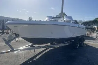 Slide: The Image of 2022 Wellcraft 202 Fisherman boat on trailer, parked outdoors. - 4