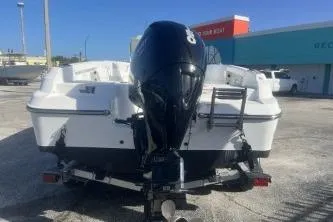 Slide: The Image of 2022 Wellcraft 202 Fisherman boat with outboard motor, parked on a trailer. - 5