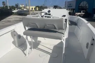 Slide: The Image of 2022 Wellcraft 202 Fisherman boat interior with seating and steering console. - 6