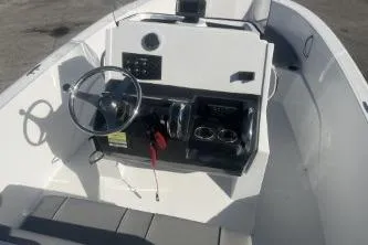 Slide: The Image of 2022 Wellcraft 202 Fisherman boat interior with steering wheel and control panel. - 7