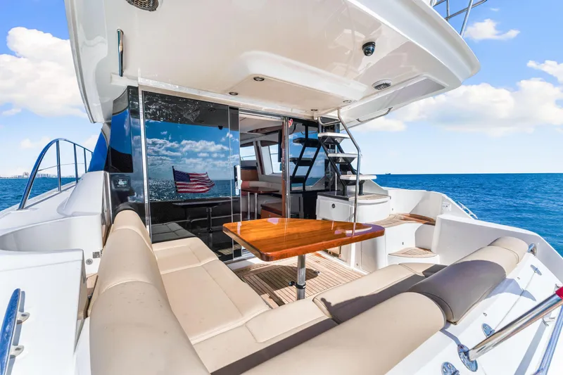 Slide: The Image of 2016 Sea Ray 510 Fly yacht with elegant seating and ocean view. - 13
