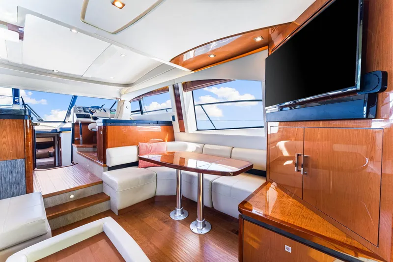 Slide: The Image of Luxurious interior of 2016 Sea Ray 510 Fly yacht with modern furnishings and large windows. - 20