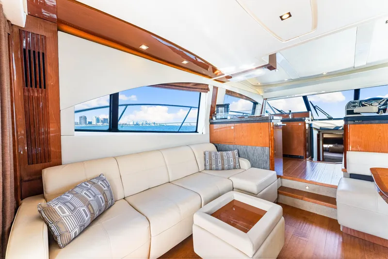 Slide: The Image of Luxurious interior of 2016 Sea Ray 510 Fly yacht with elegant seating and panoramic windows. - 21