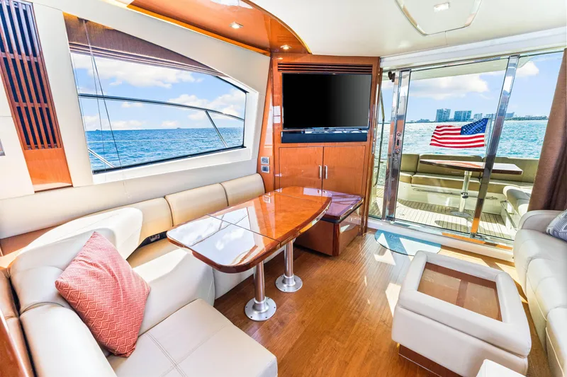 Slide: The Image of Luxurious interior of 2016 Sea Ray 510 Fly yacht with ocean view and American flag. - 23