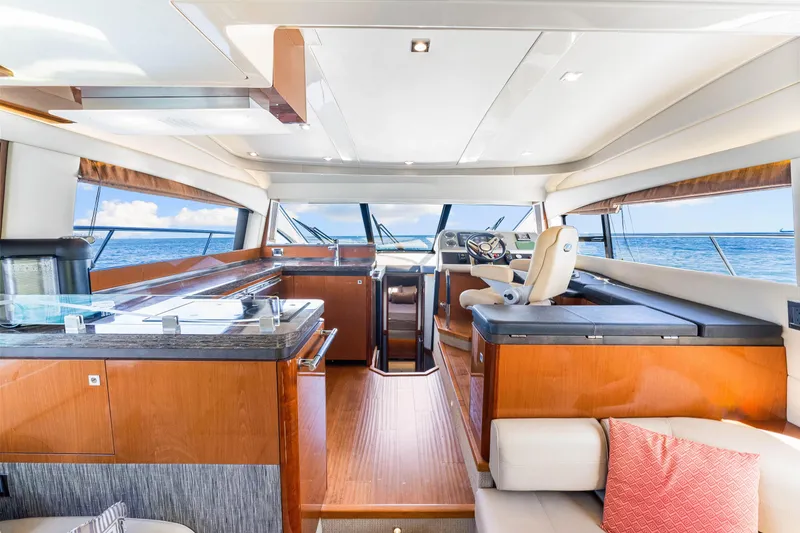 Slide: The Image of Luxurious interior of 2016 Sea Ray 510 Fly yacht with modern helm and ocean view. - 26