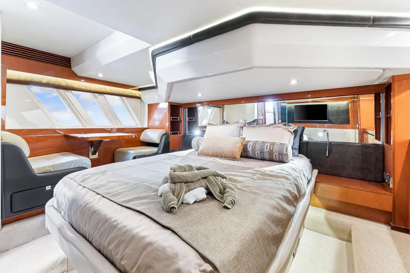 Slide: The Image of Luxurious interior of 2016 Sea Ray 510 Fly yacht with elegant bedroom and seating area. - 3
