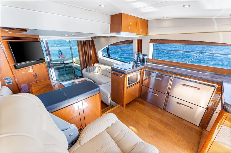 Slide: The Image of Luxurious interior of 2016 Sea Ray 510 Fly yacht with modern kitchen and ocean view. - 31