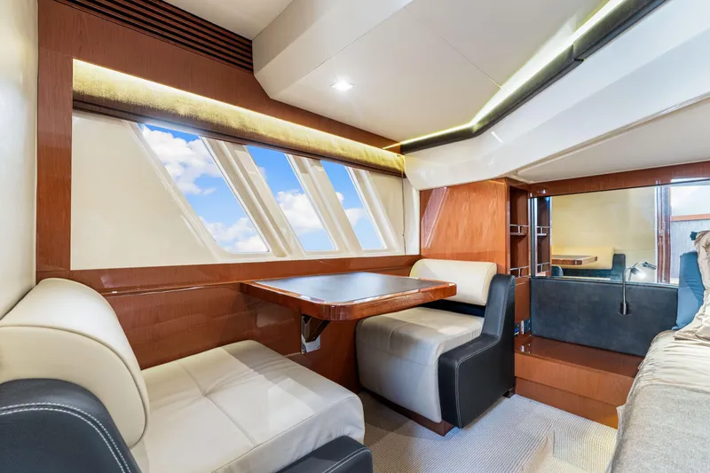 Slide: The Image of Luxurious interior of 2016 Sea Ray 510 Fly yacht with elegant seating and large windows. - 36