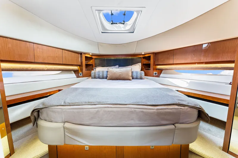Slide: The Image of Luxurious interior of 2016 Sea Ray 510 Fly yacht with elegant wood finishes and skylight. - 39