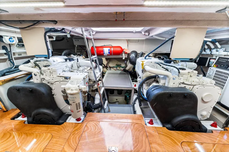 Slide: The Image of Engine room of a 2016 Sea Ray 510 Fly yacht, showcasing dual engines and equipment. - 61
