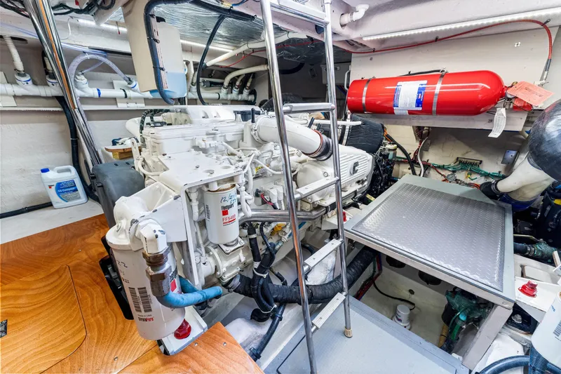 Slide: The Image of Engine room of 2016 Sea Ray 510 Fly yacht, featuring mechanical components and safety equipment. - 62