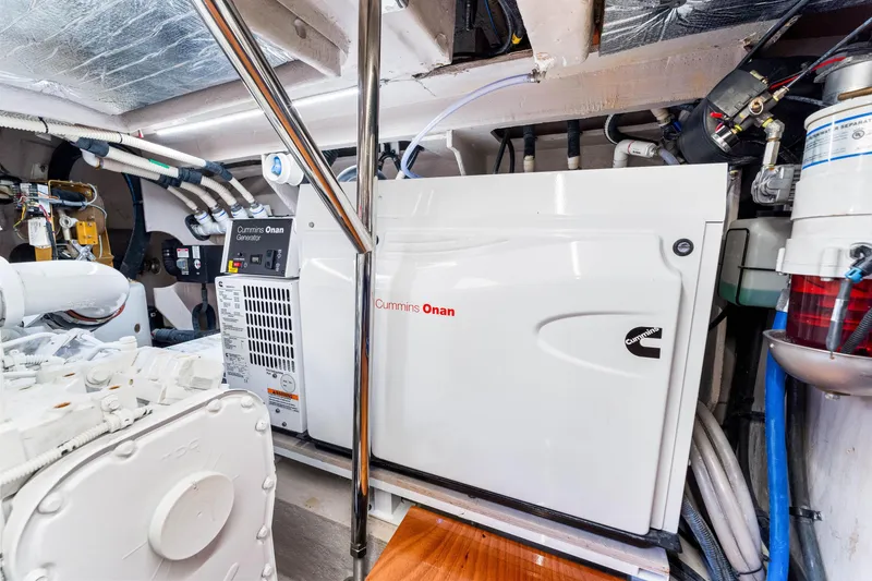 Slide: The Image of Engine room of 2016 Sea Ray 510 Fly with Cummins Onan generator. - 64