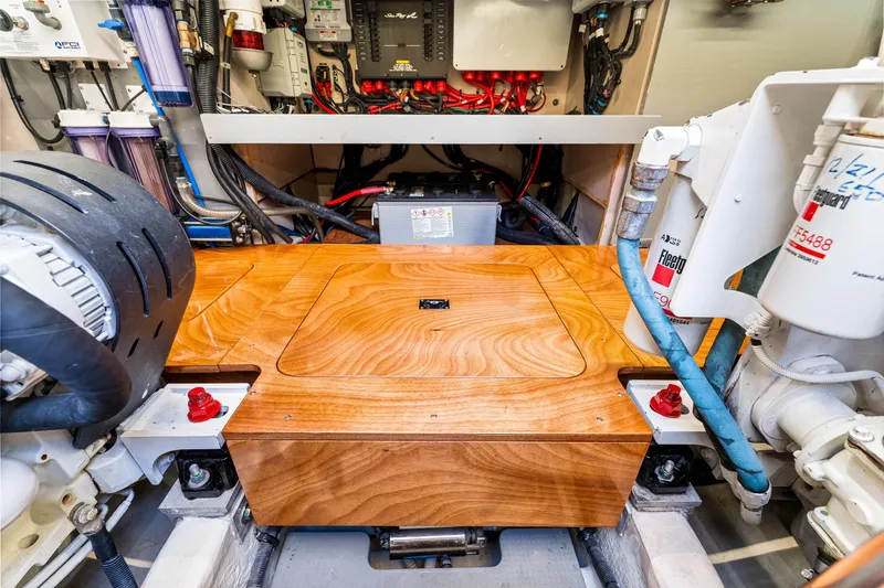 Slide: The Image of Engine room of a 2016 Sea Ray 510 Fly yacht, showcasing mechanical components and wiring. - 66