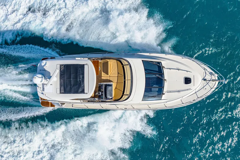 Slide: The Image of Overhead view of 2016 Sea Ray 510 Fly yacht cruising on blue ocean waters. - 9