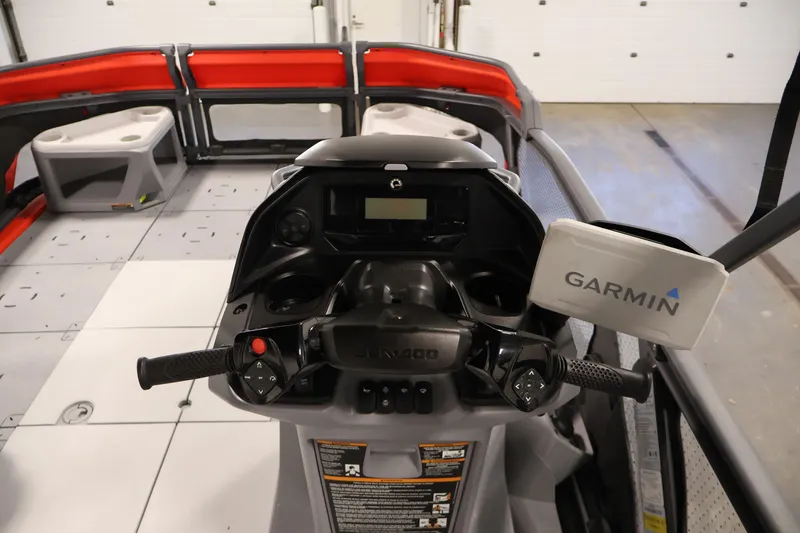 Slide: The Image of 2024 Sea-Doo Switch Cruise 18 pontoon boat in a showroom setting. - 12
