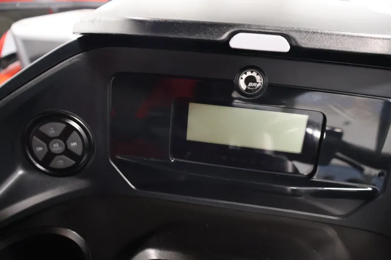 Slide: The Image of Garmin device on 2024 Sea-Doo Switch Cruise 18 dashboard in a garage setting. - 15