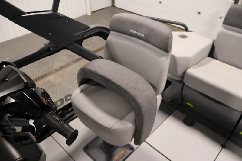 Slide: The Image of 2024 Sea-Doo Switch Cruise 18 interior seating with cup holders, showcasing modern design. - 18