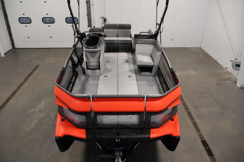 Slide: The Image of 2024 Sea-Doo Switch Cruise 18 pontoon boat interior with seating and helm. - 8