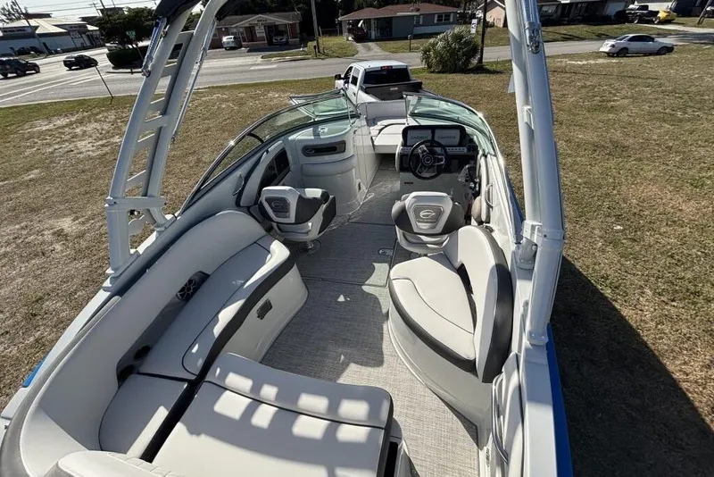 Slide: The Image of 2026 Crownline Eclipse E260 XS boat interior with modern seating and steering wheel. - 10
