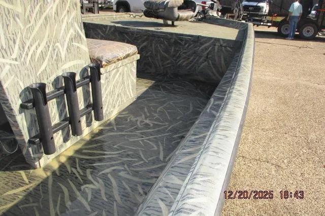 Slide: The Image of 2006 Lakesport 1860 CC boat with camouflage interior and rod holders. - 5