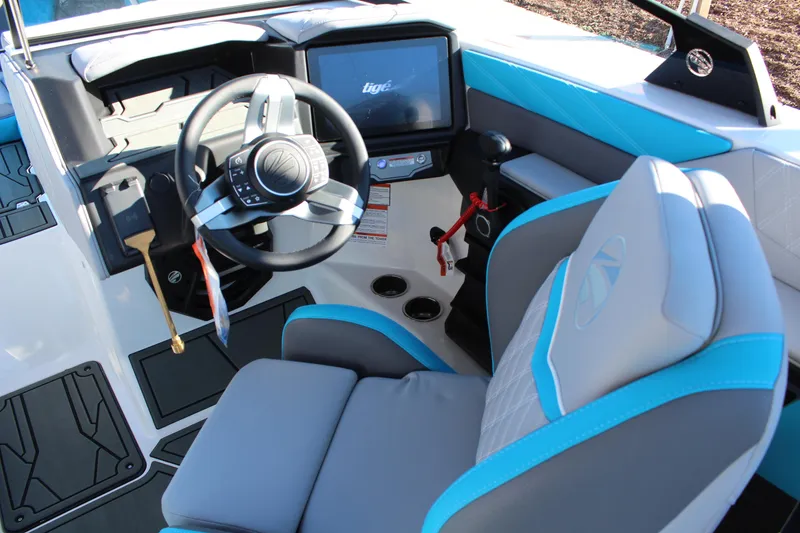 Slide: The Image of 2026 Tigé 24RZX boat interior with modern steering and control panel. - 15