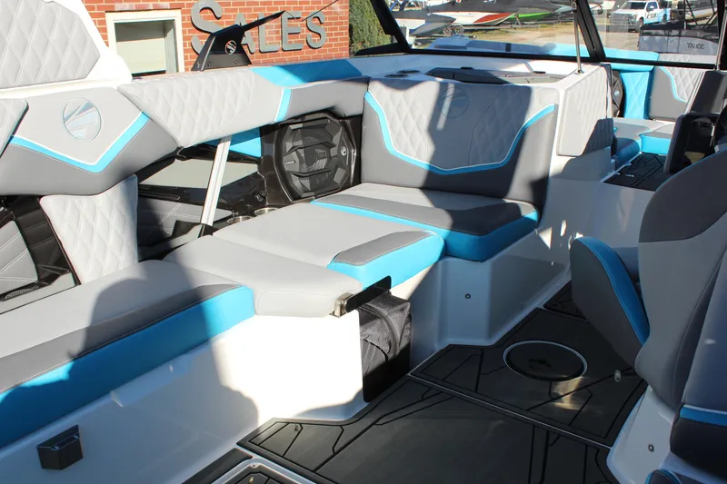 Slide: The Image of 2026 Tigé 24RZX boat interior with modern seating and blue-gray accents. - 19