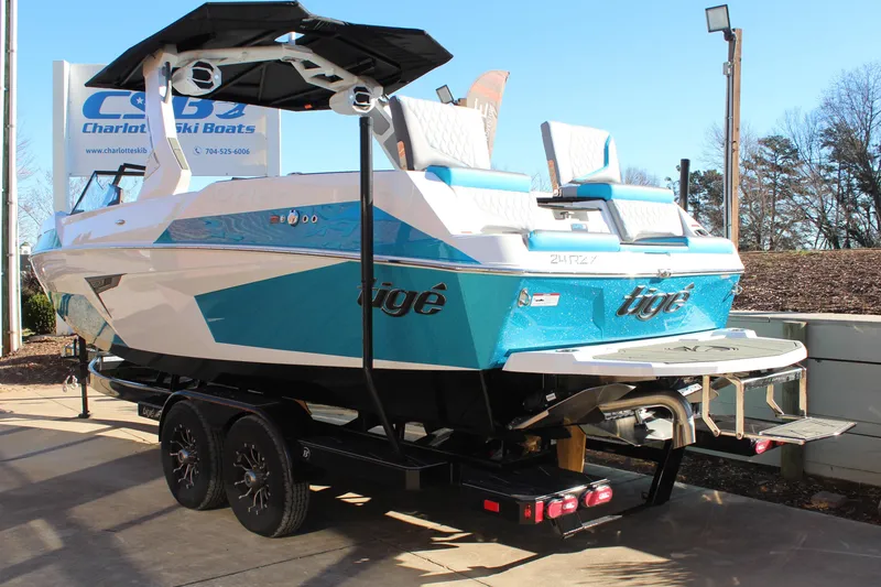 Slide: The Image of 2026 Tigé 24RZX boat on trailer at Charlotte Ski Boats dealership. - 5