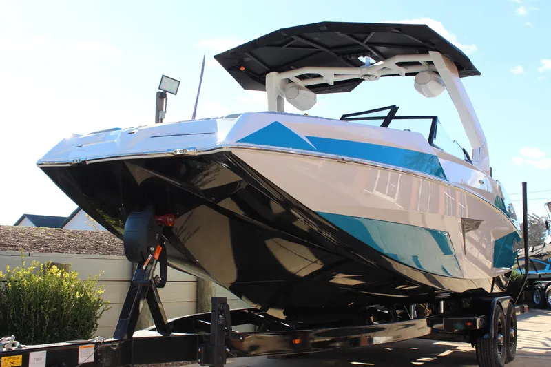 Slide: The Image of 2026 Tigé 24RZX boat on trailer, showcasing sleek design and modern features. - 6