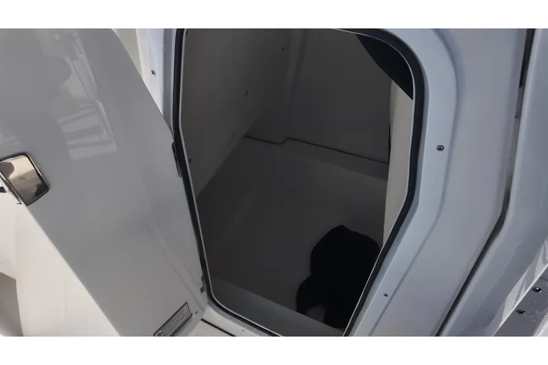 Slide: The Image of 2026 Sea Fox 228 Commander interior cabin view with open door. - 11
