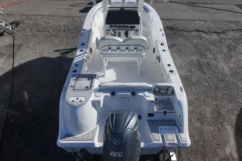 Slide: The Image of 2026 Sea Fox 228 Commander boat, aerial view, showcasing spacious deck and Yamaha engine. - 16
