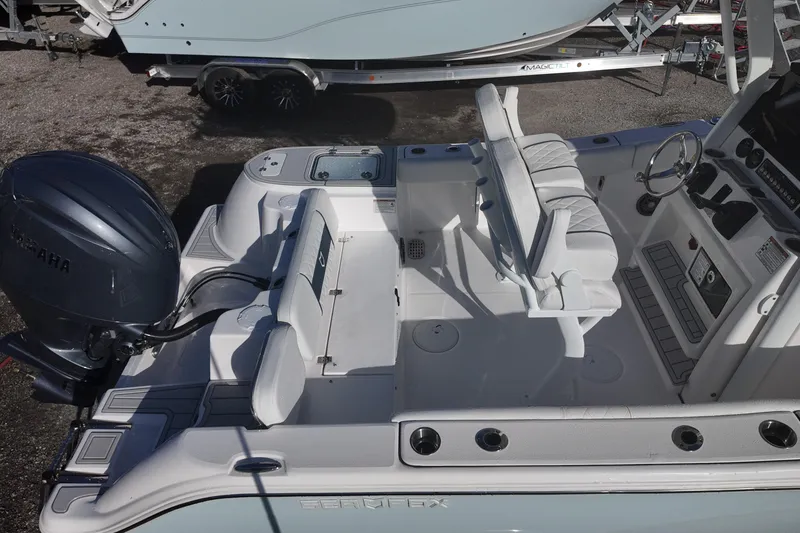 Slide: The Image of 2026 Sea Fox 228 Commander boat interior with Yamaha engine, featuring seating and control console. - 19