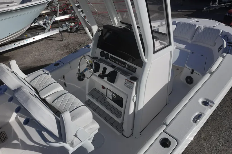 Slide: The Image of 2026 Sea Fox 228 Commander boat interior with helm and seating area. - 6