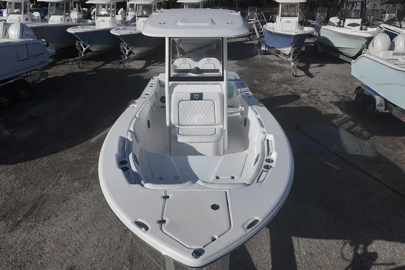 Slide: The Image of 2026 Sea Fox 228 Commander boat displayed in a marina with other vessels. - 9