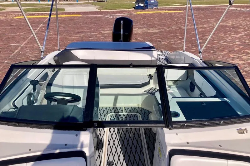 Slide: The Image of 2017 Sea Ray 19 SPX OB boat interior with windshield and seating area. - 10