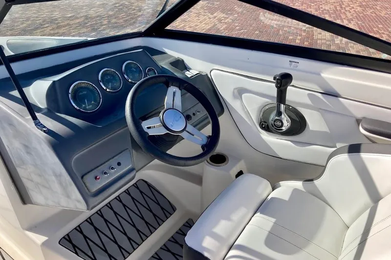 Slide: The Image of 2017 Sea Ray 19 SPX OB boat cockpit with steering wheel and control panel. - 11